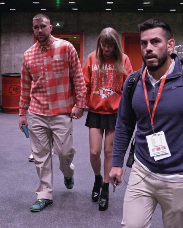 Kansas City Chiefs tight end Travis Kelce and singer Taylor Swift leave Arrowhead stadium.