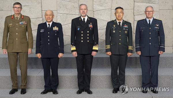 Lt. Gen. Hwang You-sung (2nd from R), vice chairman of South Korea's Joint Chiefs of Staff, poses for a photo with Dutch Adm. Rob Bauer (C), chair of the North Atlantic Treaty Organization (NATO) Military Committee, Gen. Angus Campbell (L), Australia's defense force chief, Lt. Gen. Ken-ichiro Nagumo (2nd from L), Japan's vice chief of staff of the Joint Staff, and Air Marshal Kevin Short (R), New Zealand's defense force chief, as they attend a two-day meeting of the defense chiefs of the NATO Military Committee in Brussels from Jan. 17, 2024, in this undated photo provided by the South's JCS on Jan. 19. (PHOTO NOT FOR SALE) (Yonhap)