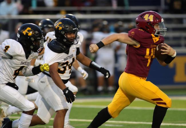 Vintage's Jeffery Page (44) runs for a long gain past Antioch's Jeremiah Olopernes (34) and other Antioch players in the first half of a Vintage High School vs. Antioch High School football game at Memorial Stadium, Friday, Sept. 1, 2023 in Napa. (Darryl Bush / For The Press Democrat)