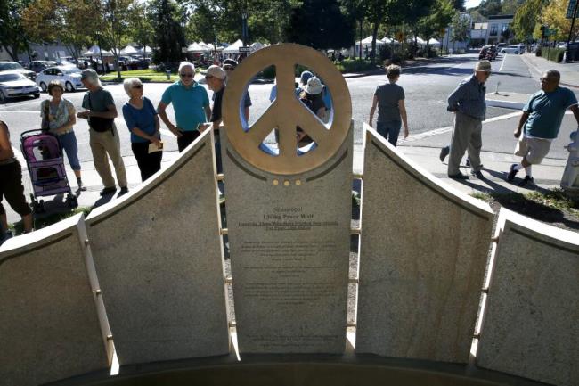 A crowd gathers during the dedication of the Living Peace Wall in Sebastopol, Sunday, Oct. 11, 2015. (Beth Schlanker / The Press Democrat file)