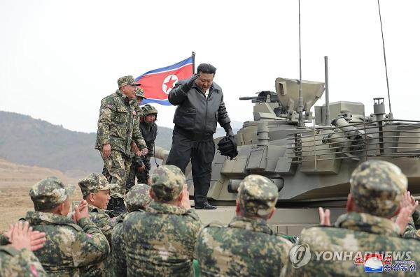 This photo, carried by North Korea's Korean Central News Agency on March 14, 2024, shows the North's leader Kim Jong-un guiding 