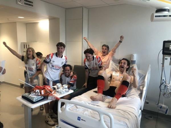 Lockyer celebrates promotion in hospital with his family