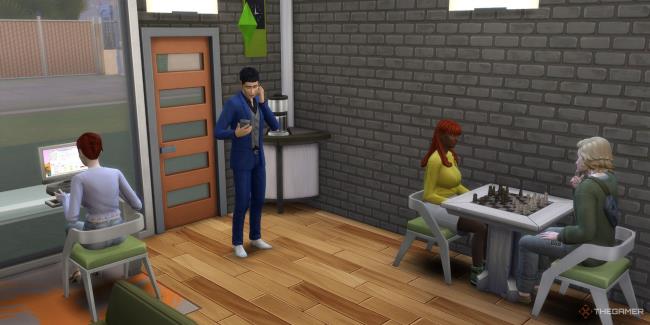 a sim at the computer and on the phone while two others play chess sims 4 tech guru career-1