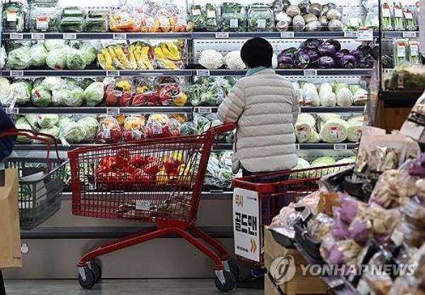 A customer shops at a major discount chain store in Seoul on March 26, 2024. (Yonhap)