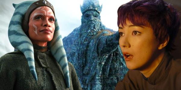 Ahsoka smiling and Sabine looking shocked either side of the Mortis statue of the Father