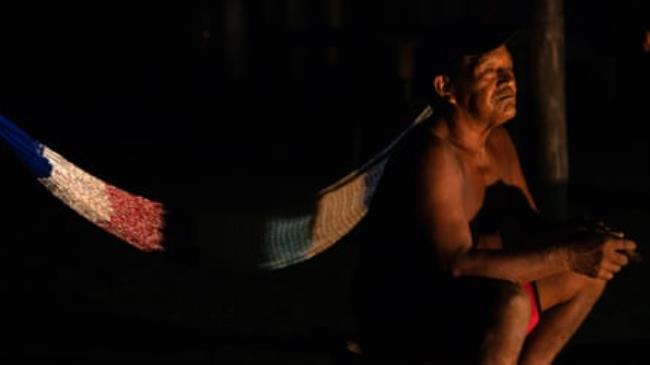 Shaman sits in shadow