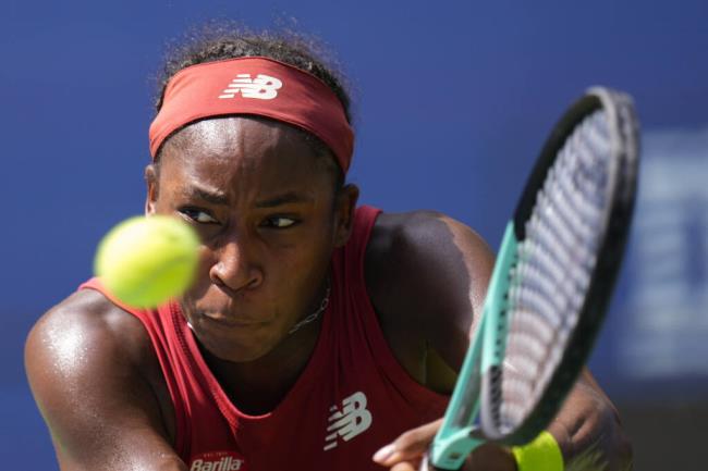 Coco Gauff returns a shot to Jelena Ostapenko during the U.S. Open quarterfinals Tuesday in New York. (Manu Fernandez / ASSOCIATED PRESS)