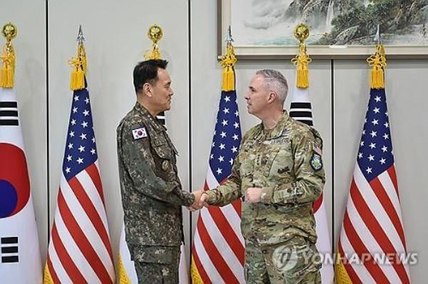Joint Chiefs of Staff (JCS) Chairman Adm. Kim Myung-soo (L) meets Gen. Stephen Whiting, head of the U.S. Space Command, at his office in Seoul on April 22, 2024, in this photo provided by the JCS. (PHOTO NOT FOR SALE) (Yonhap)