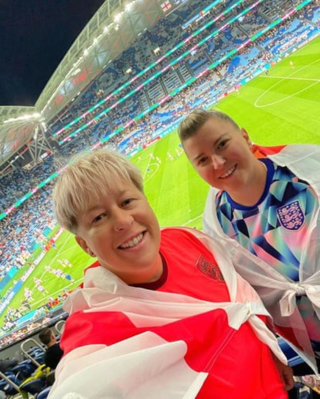 Mickey Walker and Lizzie Laws at a football stadium