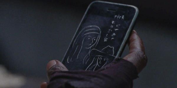 Rick iPhone message in The Walking Dead with images and text scrawled on it