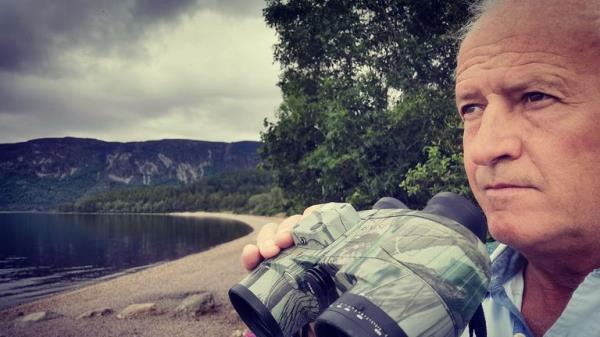 Willie Cameron, known as "Mister Loch Ness," shows photos of his sighting of an unknown animal creature in Loch Ness. In Scotland on Saturday began what is believed to be the largest search for the Loch Ness monster, called Nessie, in decades.