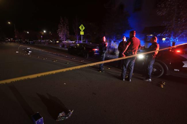 Santa Rosa police prepare to investigate the scene on Quigg Drive in Santa Rosa, where a double shooting took place, Friday, Oct. 28, 2022. (Kent Porter/The Press Democrat)