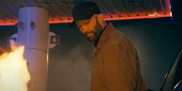 Jason Statham looking over his shoulder in The Beekeeper